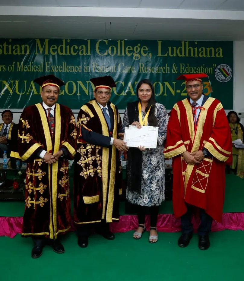 A woman receives a certificate and medal from officials in ceremonial robes at a graduation ceremony at Christian Medical College, Ludhiana. A banner and seated attendees are visible in the background.